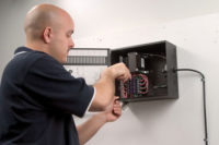 Man installing video security system