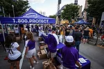 Fans Lined Up to Pickup Tickets from Guardian Purple Tents_RESIZED.jpg