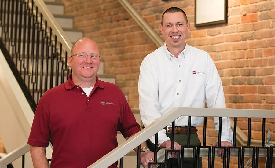 Sonitrol of Evansville's Chris Dingman (right) and security consultant Andrew Beitler visit a customer's business