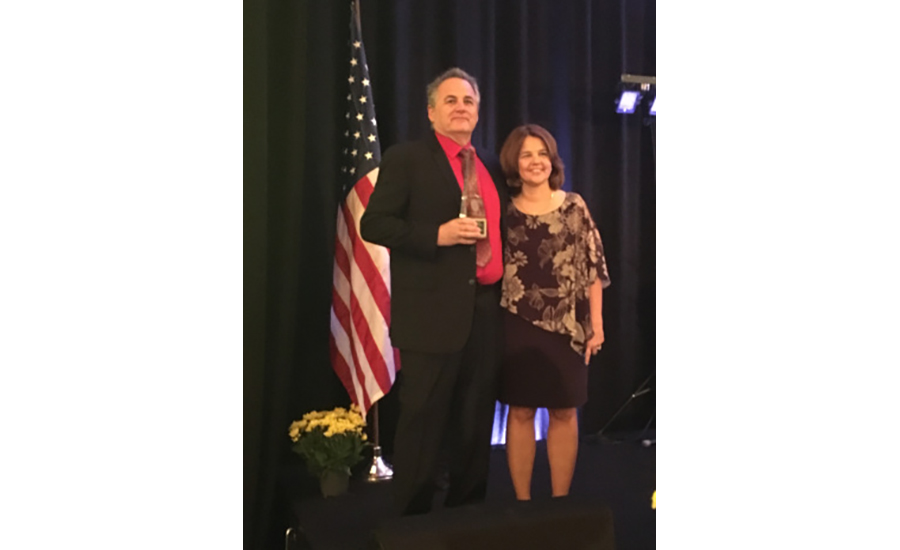 Rapid Response's Morgan Hertel of Rapid Response, with past TMA President Pam Petrow, accepts the Stanley C. Lott Memorial Award at the TMA 2017 Annual Meeting.