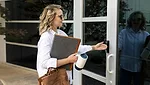 person walking into building