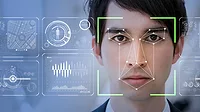 man looking at tech