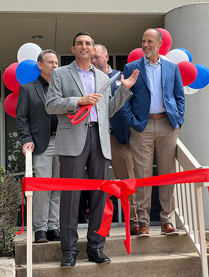 Pref-Tech President Shaun Castillo cuts the ribbon to open the new Dallas/Fort Worth branch office
