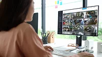 Woman watching security video 