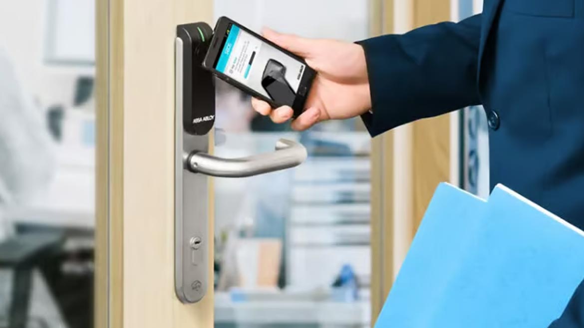 Man using cell phone to access door