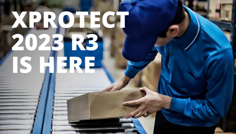 image of worker taking package off of a conveyor belt