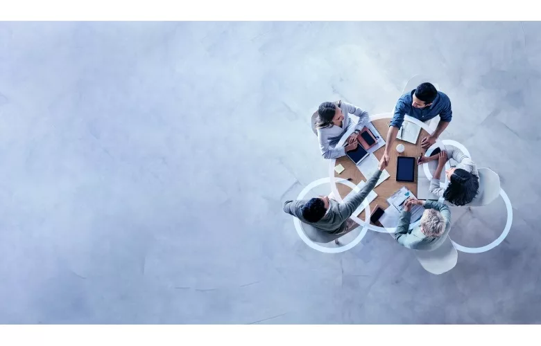 image of four professionals at a table