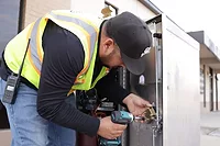 Image of technician installing ALCEA solution in Grand Prairie.