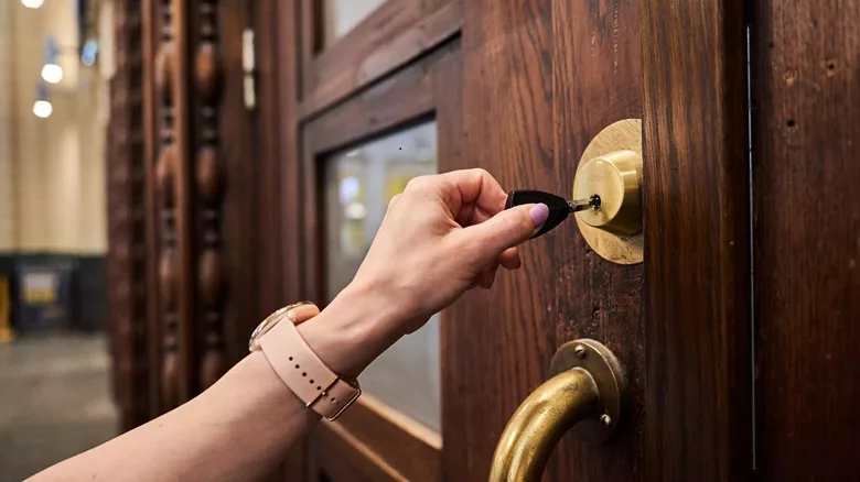 person using a lock at Helsinki Railway Station