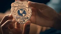 Image of an Allied Universal security badge.