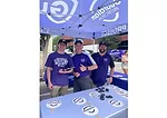 image of guardian protection vice president distributing swag to gamegoers