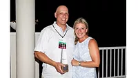 Image of Sascha Kylau holding the Stanley C. Lott Memorial Award.