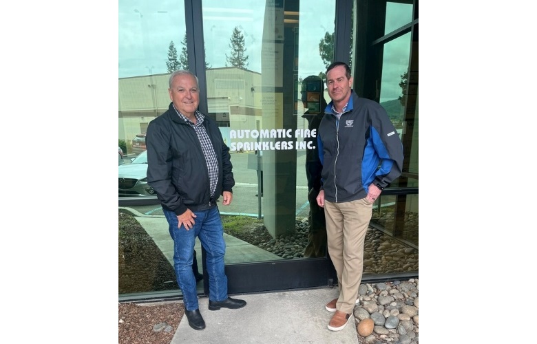 Image of Rod DiBona, COO of Pye-Barker's sprinkler division, and Gary Peterson, president and CEO at Automatic Fire Sprinklers. 