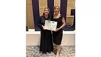 scDataCom Leader Accepts Award