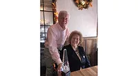 Bud and Laurie Wulforst smile with the Lott Award. Photo by Ralph Sevinor. Award