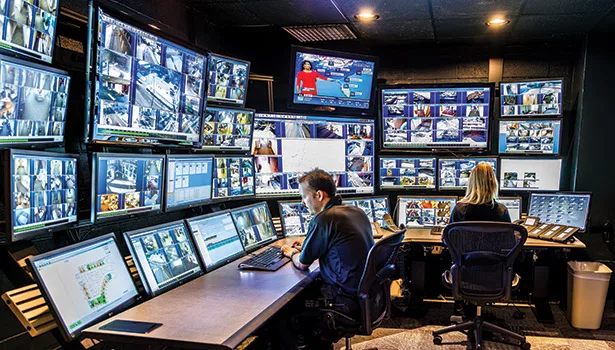 Personnel at HealthEast Care System monitor interior and exterior surveillance using a sophisticated security system.