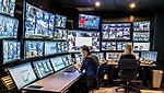 Personnel at HealthEast Care System monitor interior and exterior surveillance using a sophisticated security system.